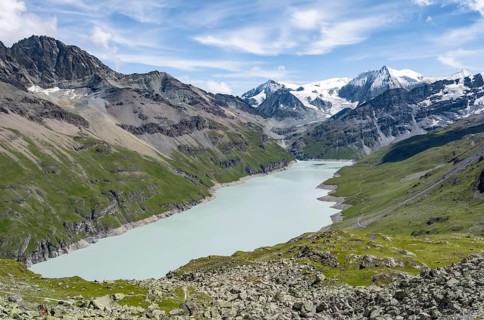 Picturesque mountain landscape, view of a blue mountain lake, Lac des Dix reservoir, behind