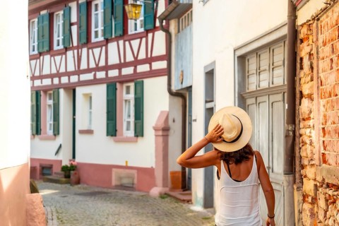 A female tourist walking in the village of Gengenbach in the Black Forest, Germany, Europe