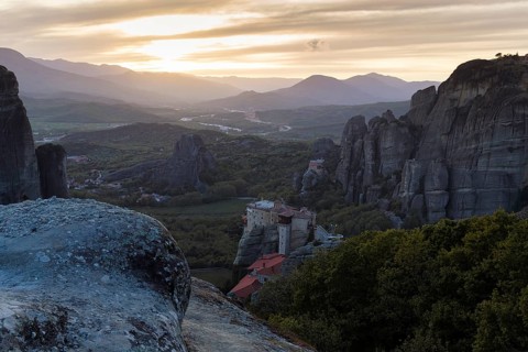 Hermitages between high cliffs, monasteries on sandstone formations, Meteora, sunset, Thessaly,