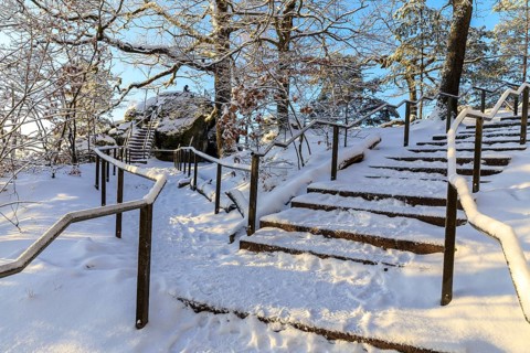 Stairs in a snow-covered rocky landscape on the ascent to the Bastei, turn-off to Kanapee Aussicht,