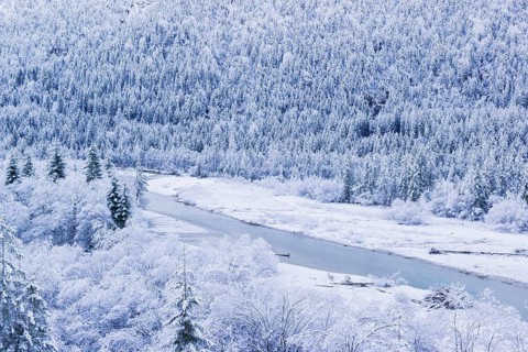 Isar valley in winter at temperatures of minus 18 degrees Celsius. Snow covered landscape with the