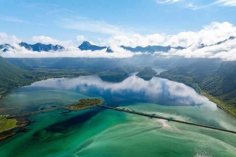 Fjord and mountains of the island Austvågøya, road on dam, Grunnførfjorden, Lofoten, Norway, Europe