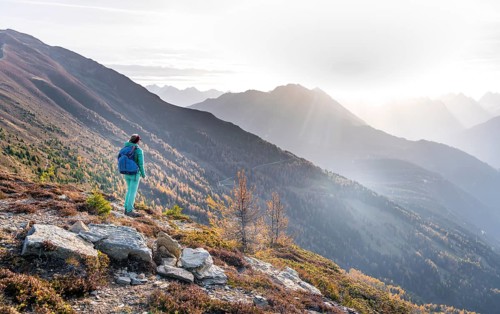 Hiker on the Venet in the morning light, view from Venet, Ötztal Alps, Tyrol, Austria, Europe