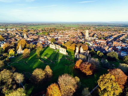Sunrise over Glastonbury Abbey from a drone, Glastonbury, Somerset, England, United Kingdom, Europe