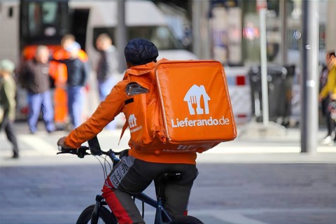 Driver of the food delivery service Lieferando, photographed in the city centre of Mannheim