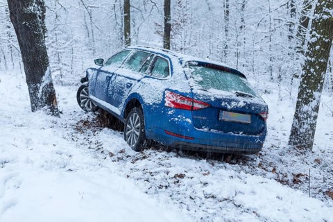 Car involved in an accident, car left the road on a bend due to snow and ice, Spitzgrund Coswig,