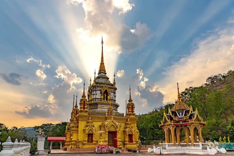 Sunbeams over the Buddhist temple Wat Namtok Mae Klang in Ban Luang, Chom Thong, Chiang Mai,