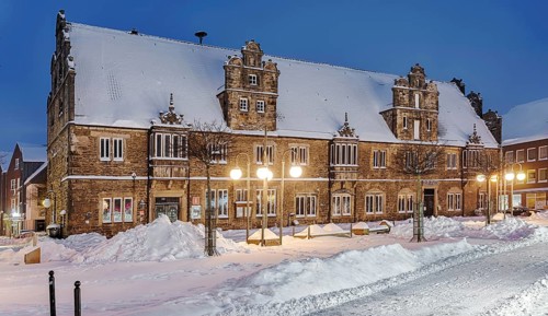 Marketplace Ratskeller winter snow illuminated Stadthagen Germany