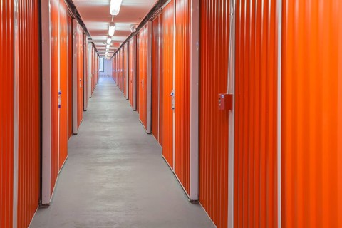 Orange interior of self storage rental units at an enclosed mini warehouse facility in Gulfport,