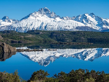 The snow-covered Mt. Cerro Castillo is reflected in a lake, Patagonia, Chile, South America