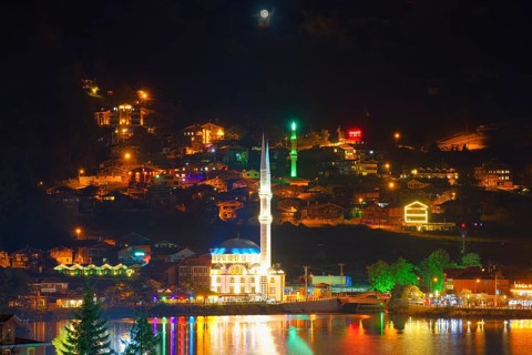 Uzungol mosque reflecting in the lake at night, Trabzon, Turkey, Asia