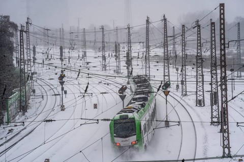 Onset of winter with lots of fresh snow and temperatures below -5 degrees during the day, railway