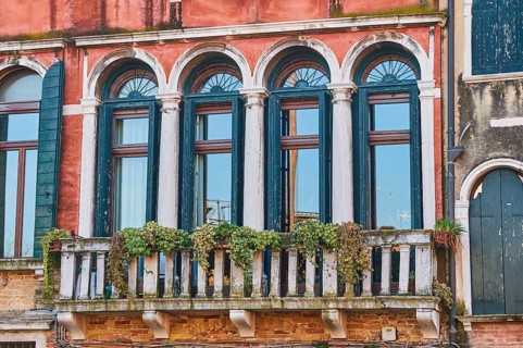 Windows of an old house on 'Campo santa margherita' town square in Venice on a sunny day in winter,