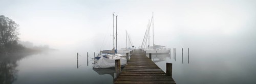 Quiet autumn morning on Lake Chiemsee, jetty with sailing boats in dense fog, Prien am Chiemsee,