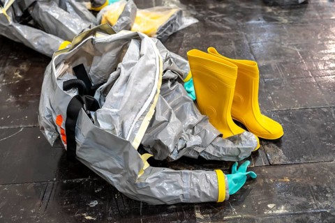Protective suits are ready, decontamination of injured persons after an assumed accident involving