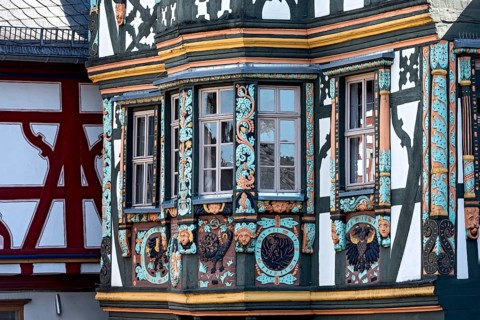 Killingerhaus, magnificent half-timbered house, colourful painted carvings on the bay window,