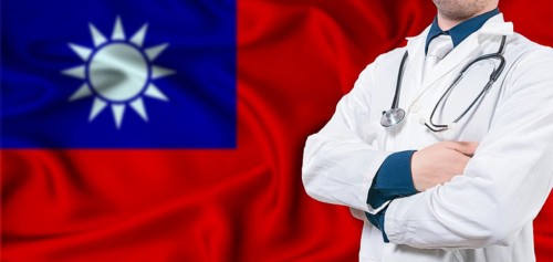 Taiwan Health Care Concept. Male Doctor on Taiwan Flag. Doctor With Crossed Arms on Taiwan Flag