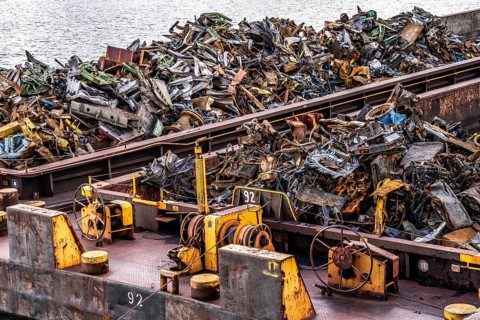 Push barge, loaded with scrap metal, for recycling, melting down, in the harbour canal,