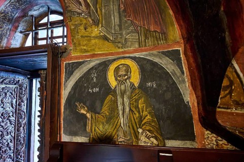 Orthodox holy picture with golden accents on a wall in a church, Inside the monastery, Agiou