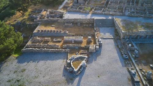 Drone shot, first morning light, overview of ancient ruins with wall remains in an archaeological