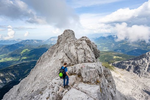Mountaineer on a narrow rocky ridge, Watzmann crossing to Watzmann Mittelspitze, view of mountain