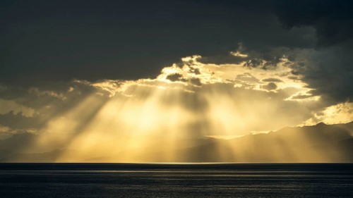 Sun rays in the clouds over Sicily, Tyrrhenian Sea, Italy, Europe