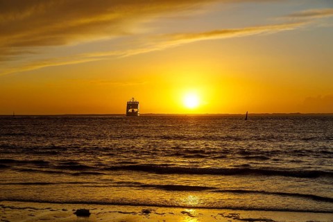 Intense sunset on the west beach of Norderney, ferry, Lower Saxony, Germany, Europe