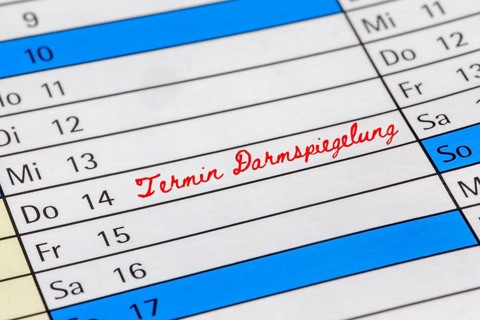 Symbolic image of colorectal cancer screening (early detection) : Calendar with note of an