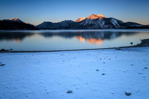 Sunrise over mountain lake, reflection, winter, Walchensee, view of Herzogstand and Heimgarten,