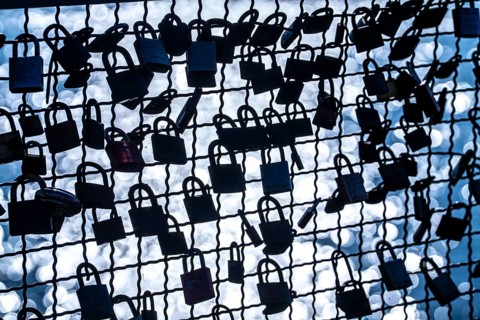Padlocks, so-called love locks on a fence, vantage point in Wesel am Rhein, North Rhine-Westphalia,