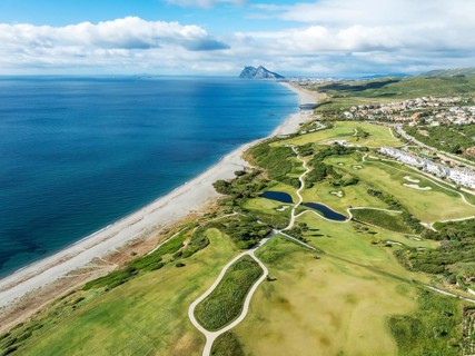 The La Hacienda Links Golf Resort at the Mediterranean Sea with the Rock of Gibraltar (British) in