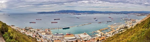 Overview of a harbour and cityscape by the sea, Gibraltar, Europe