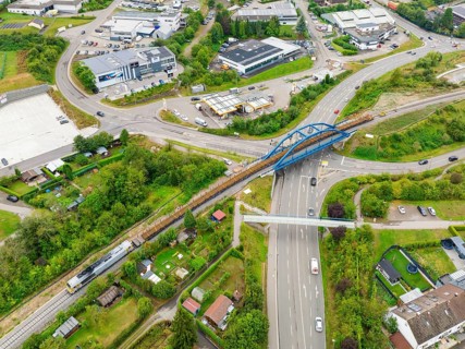 Bird's eye view of the town with traffic routes and bridges, track construction, rail delivery for