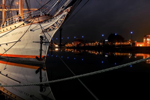 View of the bow of a tethered sailing ship at night, Bremerhaven, Bremen, Germany, Europe