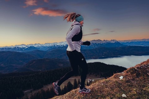 Trail running in autumn on the Jochberg on Lake Walchensee against the wonderful backdrop of the