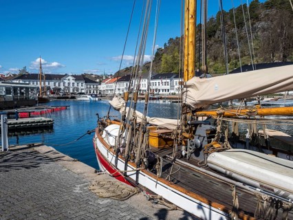 At the seaside in Risor, a traditional village with wooden white houses at the southern norwegian