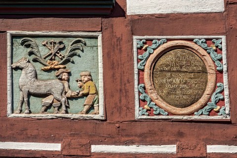 Colourful painted carvings, relief for blacksmith Johenrich Jung, medallion with inscription, on