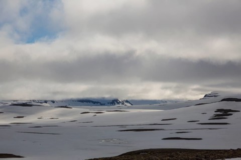 Snowfields at the Heidarvatn lake between Seydisfjördur and Eglisstadur in E Iceland