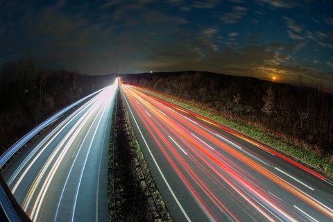 A7 Motorway, Autobahn, beside Kassel at night with light trails from the traffic headlights and