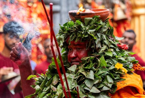 GUWAHATI, INDIA, AUGUST 19: Priest dance in the beat of Dhol (Drum) during the annual