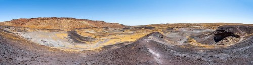 Dry landscape with yellow grass and black volcanic hills, Burnt Mountain, Damaraland, Kunene,