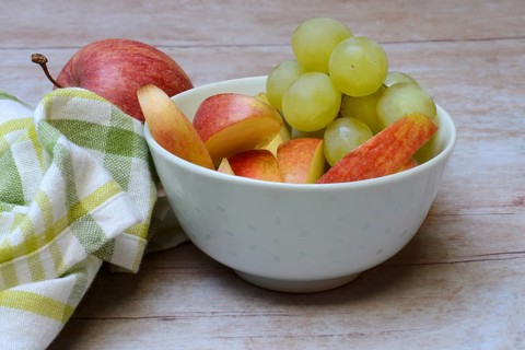 Apple slices and grapes in skin