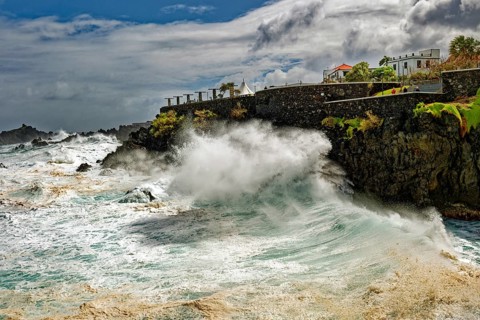 High waves on the rocks of Porto Moniz, surf on the Atlantic Ocean, storm, clouds, Porto Moniz,