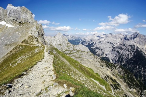 A hiking trail on a ridge with a view of a mountain landscape, Karwendel, Mittenwald, Bavaria,