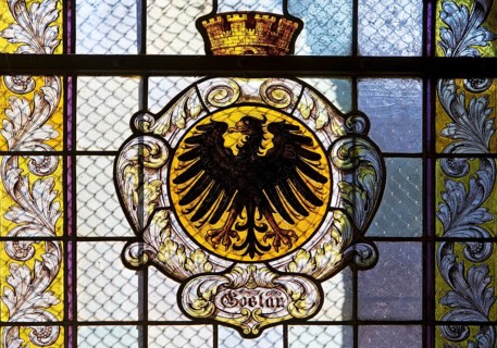 Stained glass window with the city coat of arms in the market church of St Cosmas and Damian,