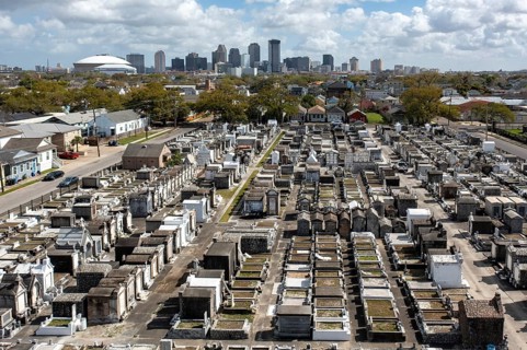 New Orleans, Louisiana - An aerial view of St. Joseph Cemetery #1, with the downtown skyline in the