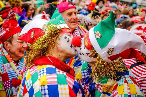 Colourfully costumed carnivalists celebrate carnival in Cologne, on Weiberfastnacht the street
