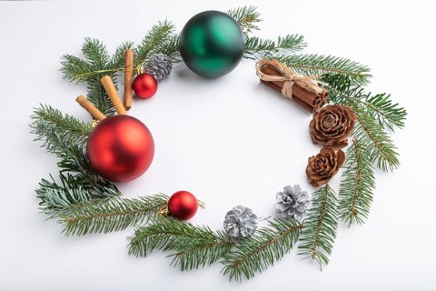 Christmas or New Year wreath composition. Decorations, balls, cones, fir and spruce branches, on