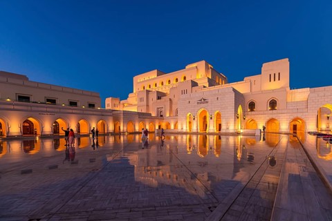 Visitors view the main square in front of the Royal Opera in the evening light, Muscat, Arabian