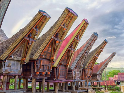Traditional colourful houses, curved roofs, village in Tana Toraja, Rantepao, Sulawesi, Indonesia,